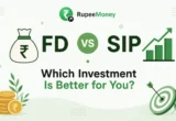 FD vs SIP comparison illustration with RupeeMoney logo, fixed deposit money bag, SIP growth chart, rupee coins, investment target icon, and the title "Which Investment Is Better for You?" helping Indian investors compare FD and SIP.