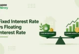 Fixed Interest Rate vs Floating Interest Rate comparison illustration featuring a balance scale, security shield, house icon, fixed-rate symbol, floating-rate growth chart, rupee coins, and the RupeeMoney logo, explaining different home loan interest rate options in India.