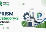 PRISM Category-2 Scheme illustration featuring the RupeeMoney logo, industrial innovation icons, factory, gear, approval shield, and growth chart representing India's PRISM Category-2 Scheme for technology development and MSME innovation.